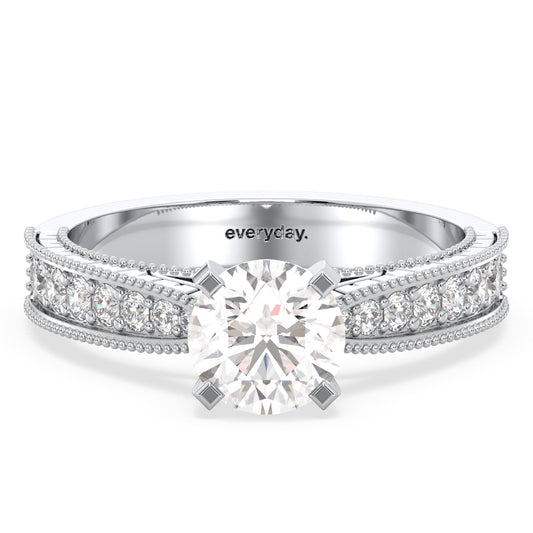 SOPHIA ROUND CUT LAB GROWN DIAMOND SOLITAIRE ENGAGEMENT RING WITH A FANCY HALF STUDDED SHANK, GOLD